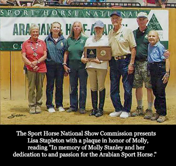 Lisa is presented with a plaque for Molly
